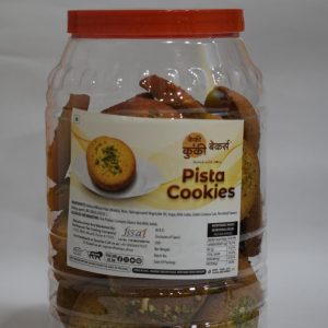 Cakey and Cookie Bakers Pista Cookies in a clear plastic jar with a red lid.