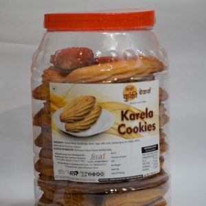 Crispy fluted Indian tea-time Karela biscuits packed in a transparent airtight storage container jar by Cakey and Cookie Bakers.