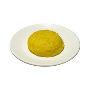 Freshly prepared bright yellow South Indian Rava Kesari served on a white plate.