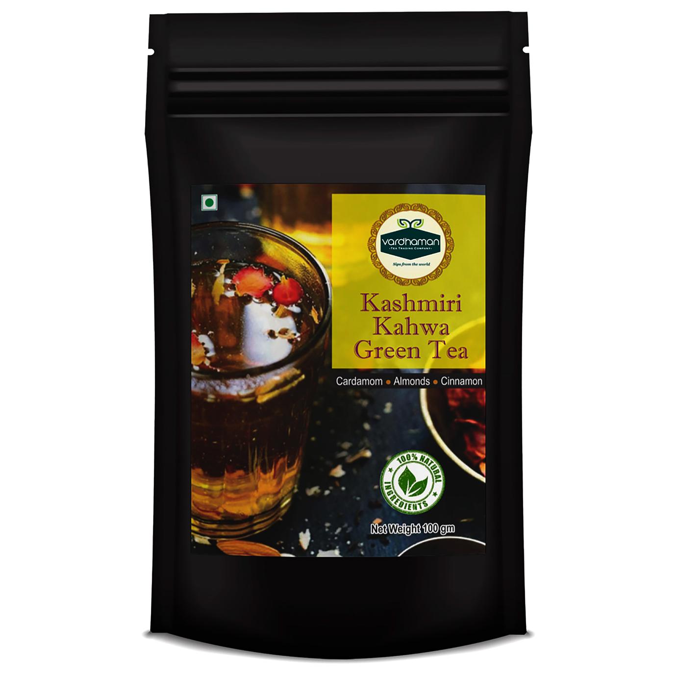Black stand-up pouch of Vardhaman 100g Kashmiri Kahwa Green Tea, featuring a yellow-accented label showing a glass of tea with cardamom, almonds, and cinnamon.